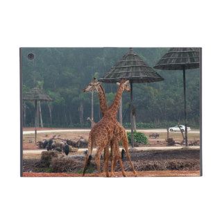 Two giraffes comforting each other in a zoo iPad mini cover