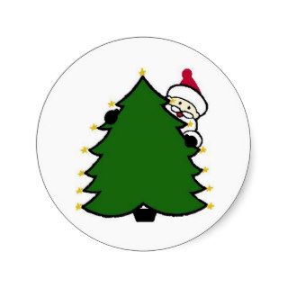 Santa Hides Behind Christmas Tree Round Sticker