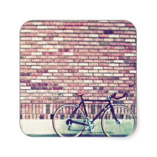 bike against brick wall square sticker