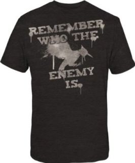 Hunger Games   Catching Fire T Shirt   Remember Who The Enemy Is (Medium) Novelty T Shirts Clothing