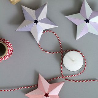 paper christmas star decorations set by another studio