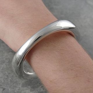 chunky sterling silver flowing bangle by otis jaxon silver and gold jewellery