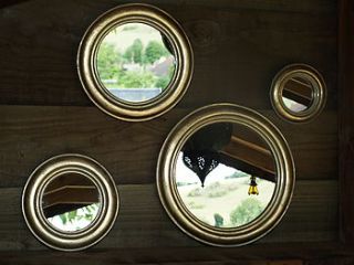 set of four round gold leaf mirrors by begolden