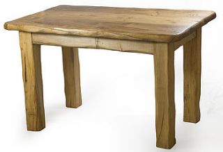 handmade solid wooden dining table by kwetu