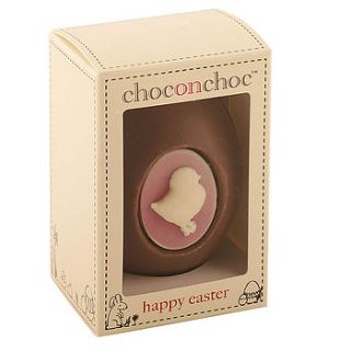 handmade chocolate easter egg with chick by chocolate on chocolate