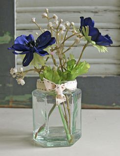 blue anemone in jam jar by berry red