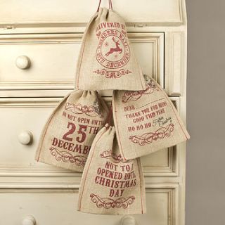 set of four jute christmas gift bags by dibor