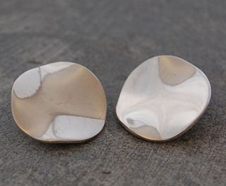 silver wavy disc clip on earrings by otis jaxon silver and gold jewellery