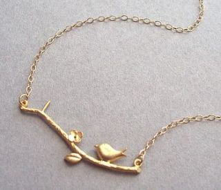 gold bird on branch necklace by a box for my treasure