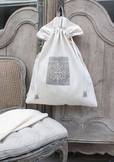 drawstring linen bag with embroidered motif by chia maria london