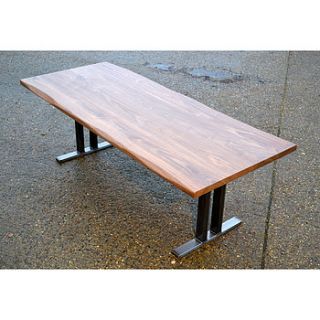 walnut dining table with steel pedestal legs by wicked boxcar
