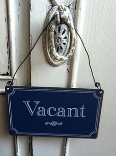 'occupied/vacant' metal sign by the hiding place