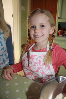 child's daisy design apron by the shed inc