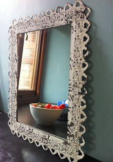 ornate framed mirror by the forest & co
