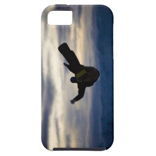 A male snowboarder does a back flip while riding iPhone 5 covers