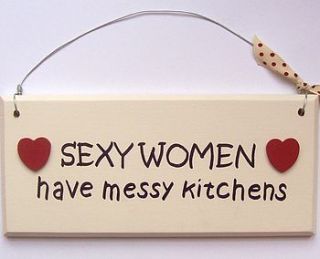 'sexy women have messy kitchens' sign by the painted broom company