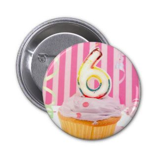 Birthday cupcake with the number six candle lit pins