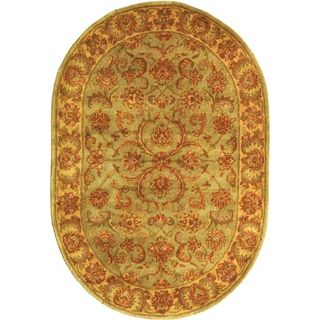 Handmade Heritage Kermansha Green/ Gold Wool Rug (46 X 66 Oval)