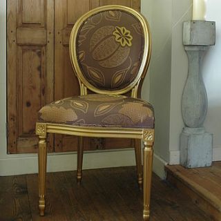 vintage reupholstered chocolate and gold chair by ghost furniture