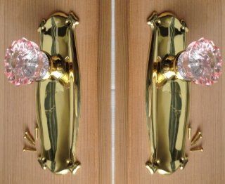 Two Pink Surface Mount Dummy Knobs. A Perfect Replica of the 1900's Depression Crystal Knob color coated on the sides and reflects to the center. Includes installation hardware for one side of two doors or both sides of one French door,   Doorknobs  