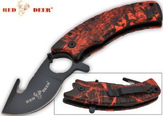 RDX 9805. 7.5 Inch Red Deer Trigger Assisted Knife   Red Camo What would be the perfect knife to take on your deer hunting conquests? Look no further our exclusive Red Deer knife with it's specialty made blade is all you need gut that deer folding kni