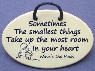 Sometimes the smallest things take up the most room in your heart Christopher Robin speaking to Winnie the Pooh. Mountain Meadows ceramic plaques and wall signs with sayings and quotes about love, babies, and pets. Made by Mountain Meadows in the USA.   H